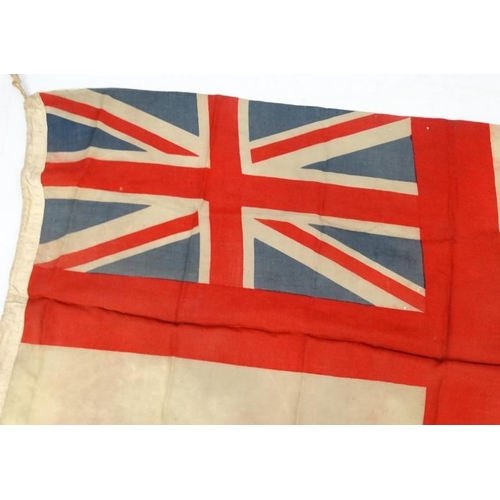 372 - Militaria : A large mid-20thC British Royal Navy White Ensign flag , probably from a WWII vessel , a... 