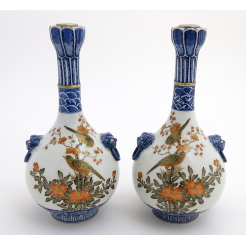 400 - A pair of Chinese twin handled Sauntouping (garlic head) bottle vases, each decorated with birds ami... 