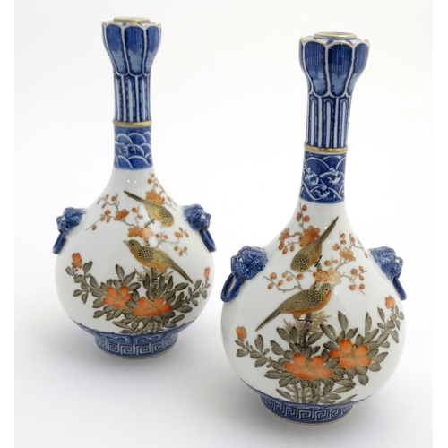 400 - A pair of Chinese twin handled Sauntouping (garlic head) bottle vases, each decorated with birds ami... 