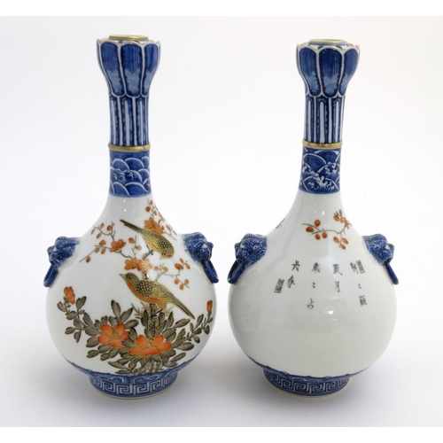 400 - A pair of Chinese twin handled Sauntouping (garlic head) bottle vases, each decorated with birds ami... 