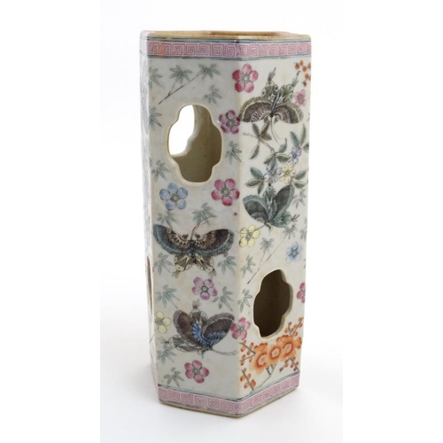 402 - A Chinese famille rose vase of hexagonal form decorated with butterfly's amongst flowers, having cut... 