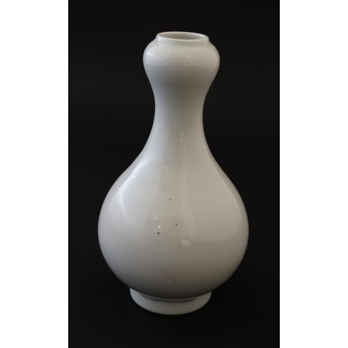 405 - A white Chinese Sauntouping (garlic head) bottle vase, having blue 6 character mark to base, togethe... 