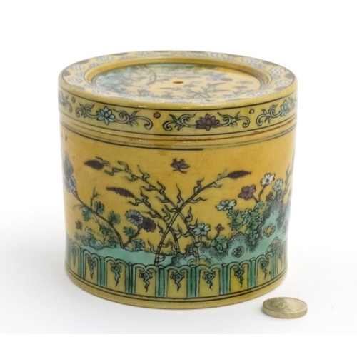 417 - A Chinese Imperial yellow pot and cover , the sides and cover decorated with flowering plants on roc... 