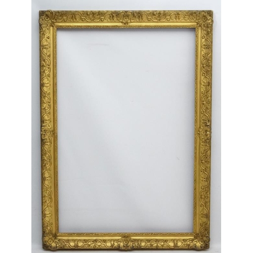 74 - Gilt frame : a large ornate XIX gilded gesso and wood frame having internal measurements  55 1/4 x 3... 