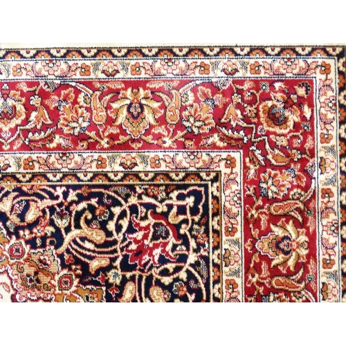 83 - Carpet / Rug : A machine made beige ground with black, red, cream and buff colours , Keshan carpet 3... 