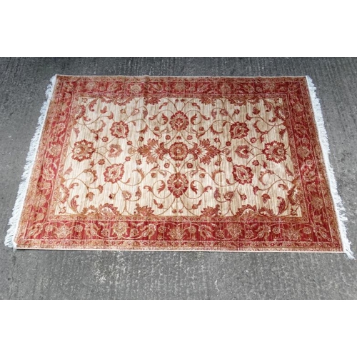 84 - Carpet / Rug : A machine made beige ground and red Ziegler carpet 93L x 63''W''  Please Note -  we d... 