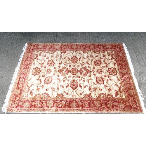 84 - Carpet / Rug : A machine made beige ground and red Ziegler carpet 93L x 63''W''  Please Note -  we d... 