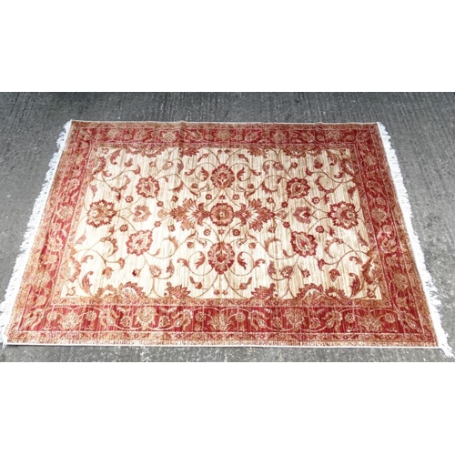 84 - Carpet / Rug : A machine made beige ground and red Ziegler carpet 93L x 63''W''  Please Note -  we d... 