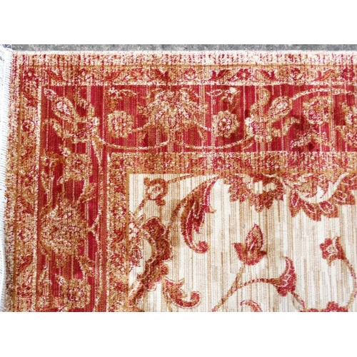 84 - Carpet / Rug : A machine made beige ground and red Ziegler carpet 93L x 63''W''  Please Note -  we d... 