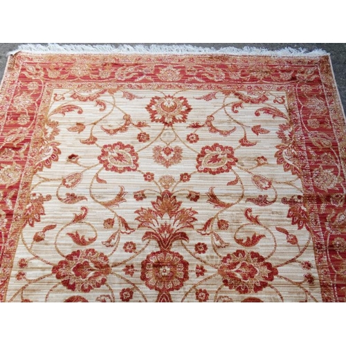 84 - Carpet / Rug : A machine made beige ground and red Ziegler carpet 93L x 63''W''  Please Note -  we d... 