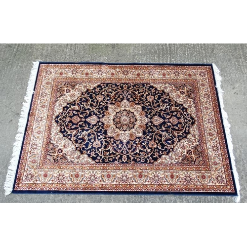 85 - Carpet / Rug : A machine made blue Keshan rug  with cream, blue black , mustard, etc colours , 79 L ... 