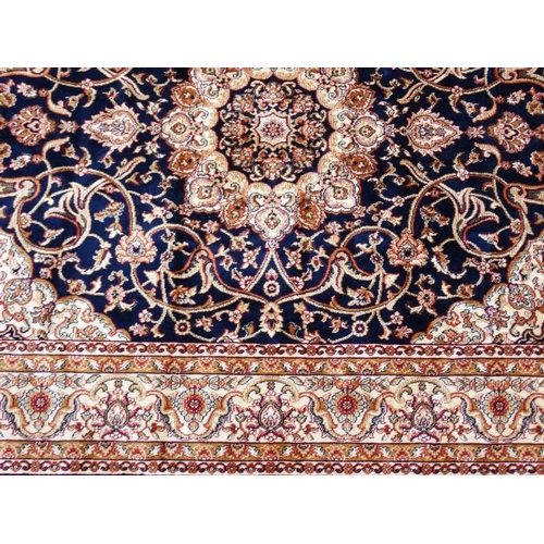 85 - Carpet / Rug : A machine made blue Keshan rug  with cream, blue black , mustard, etc colours , 79 L ... 