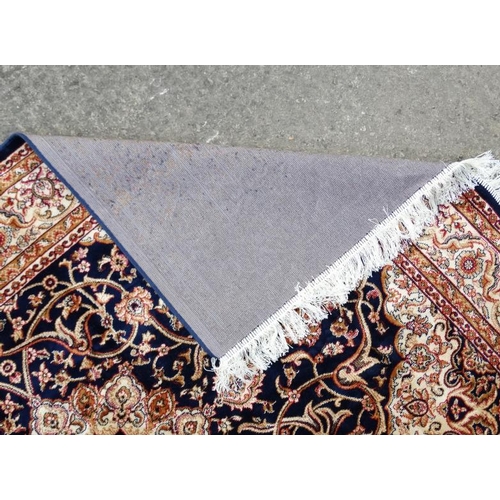 85 - Carpet / Rug : A machine made blue Keshan rug  with cream, blue black , mustard, etc colours , 79 L ... 