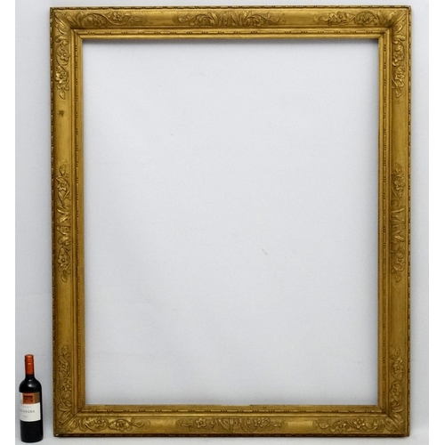 212 - Gilt frame : an ornate XIX gilded gesso and wood frame having internal measurements 48 1/2 x 39 1/4'... 