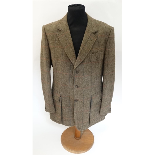 100 - A James Purdey & Sons tweed shooting jacket, approx. 46'' chest measurement.