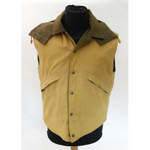 114 - A Holland & Holland ladies gilet, in tan colour, size L