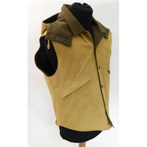 114 - A Holland & Holland ladies gilet, in tan colour, size L