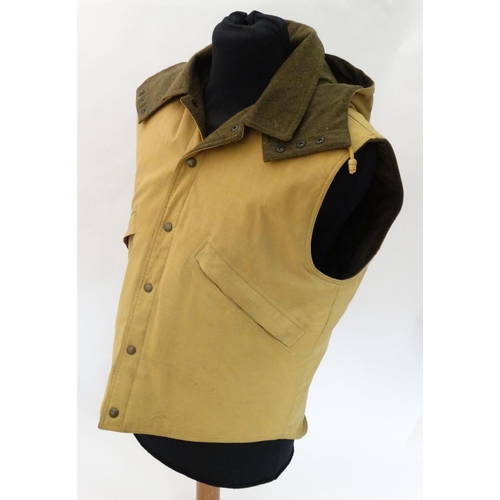 114 - A Holland & Holland ladies gilet, in tan colour, size L