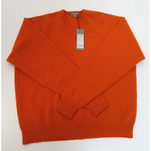 124 - A Laksen Astor knit shooting jumper in orange, size XL, new with tag