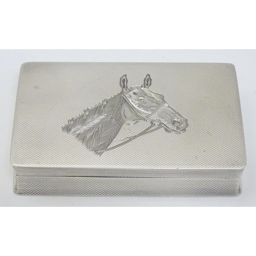 128 - A Geo VI silver box with engine turned and engraved horse head decoration. Hallmarked Birmingham 195... 