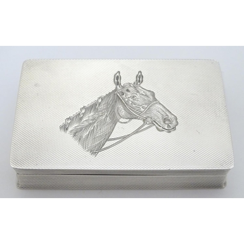 128 - A Geo VI silver box with engine turned and engraved horse head decoration. Hallmarked Birmingham 195... 