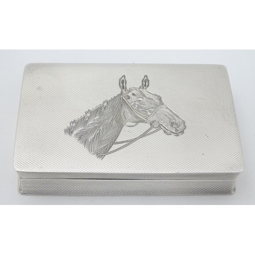 128 - A Geo VI silver box with engine turned and engraved horse head decoration. Hallmarked Birmingham 195... 