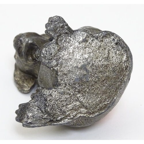 135 - An early 20thC novelty cast metal pin cushion formed as a seated puppy dog with glass eyes. Approx 2... 