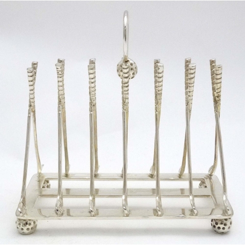 137 - A novelty 6-slice silver plated toast rack, the bars formed as crossed golf clubs. 21stC  Approx 6 1... 