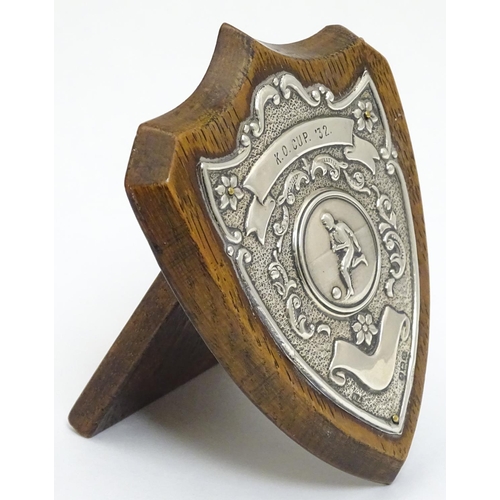 138 - Football Interest : A silver mounted oak presentation / trophy shield titled ' K. O Cup '32' depicti... 