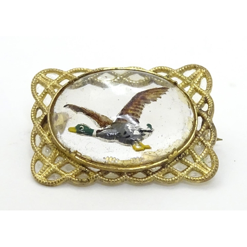 140 - A gilt metal brooch set with Essex Crystal cabochon to centre depicting a Mallard duck in flight 1''... 