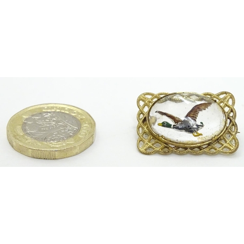 140 - A gilt metal brooch set with Essex Crystal cabochon to centre depicting a Mallard duck in flight 1''... 