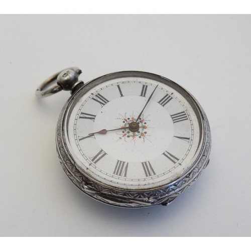 141 - A ladies hallmarked silver pocket watch with later applied ceramic cabochon decorated with  head of ... 