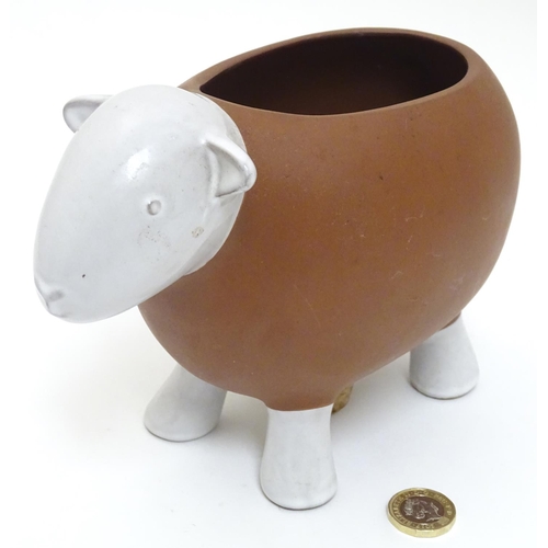 143 - A Novelty ceramic jardiniere / plant pot formed as a sheep. Approx 8 1/2'' long