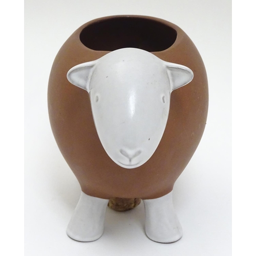 143 - A Novelty ceramic jardiniere / plant pot formed as a sheep. Approx 8 1/2'' long