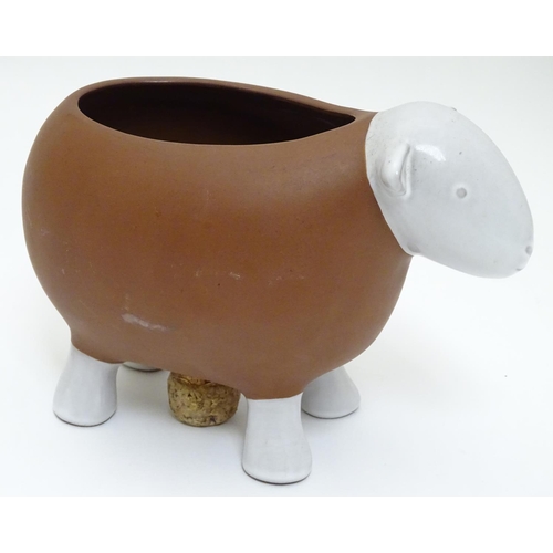 143 - A Novelty ceramic jardiniere / plant pot formed as a sheep. Approx 8 1/2'' long