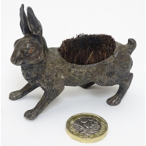 144 - A Victorian Novelty pen wipe formed as a cast model of a hare with red painted eyes and bristles to ... 