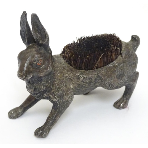 144 - A Victorian Novelty pen wipe formed as a cast model of a hare with red painted eyes and bristles to ... 