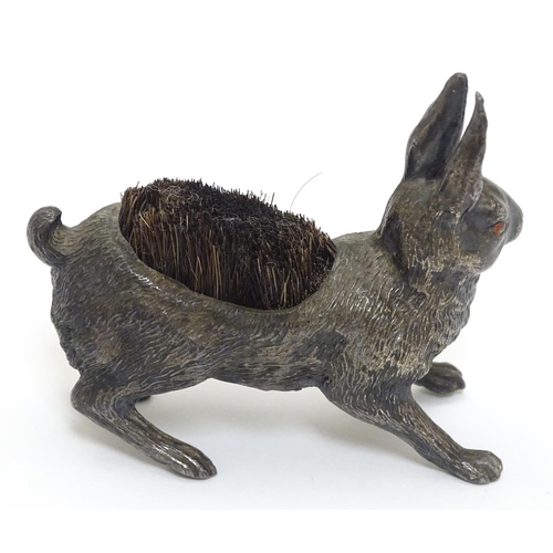 144 - A Victorian Novelty pen wipe formed as a cast model of a hare with red painted eyes and bristles to ... 