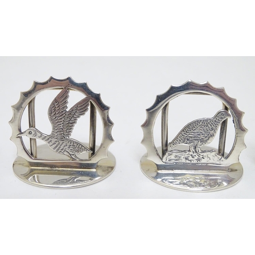 149 - A set of 12 ( 6+6) silver menu / table place card holders decorated with snipe, partridge, duck, sta... 