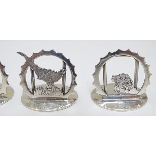 149 - A set of 12 ( 6+6) silver menu / table place card holders decorated with snipe, partridge, duck, sta... 