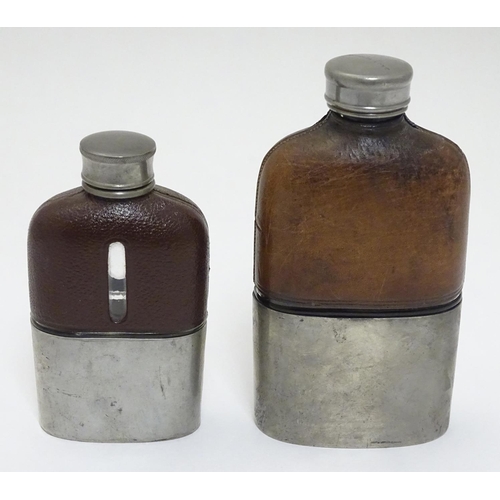 153 - A half leather covered hip flask with beaker to lower half. Marked G & JW Hawksley 5 1/4'' high. Tog... 