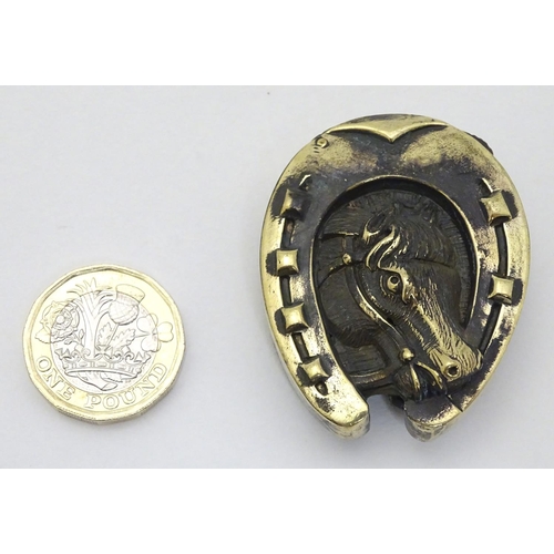 156 - A novelty brass vesta case with horse shoe and horse head decoration. Approx 2'' high