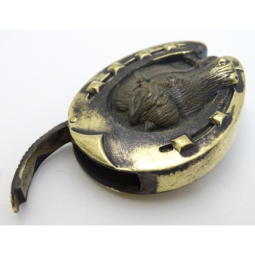 156 - A novelty brass vesta case with horse shoe and horse head decoration. Approx 2'' high