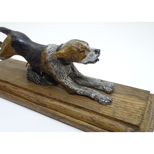 166 - A desk top letter clip formed as a cold painted bronze hound / dog mounted on an stained oak base. 2... 