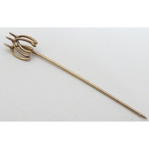 172 - Equine / horse Riding Interest : A yellow metal stick in surmounted by 3 wishbones 2'' long overall