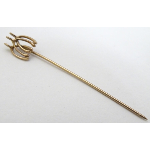 172 - Equine / horse Riding Interest : A yellow metal stick in surmounted by 3 wishbones 2'' long overall