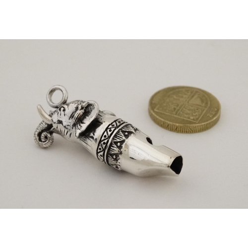 173 - A novelty silver whistle with elephant head decoration. 21stC  1 1/2'' long