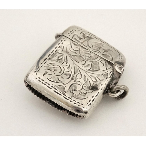 174 - A silver vesta case with later applied 21stC ceramic cabochon with dog decoration. The whole 1 3/4''... 