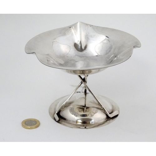 175 - A silver plate pedestal bon bon dish / small tazza, supported on three crossed golf clubs and on a c... 