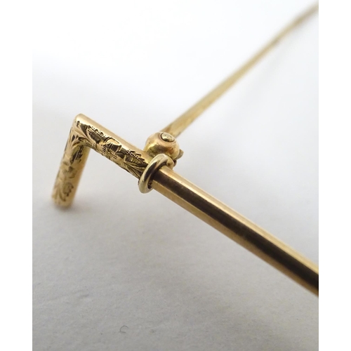 177 - Equine / Horse Riding Interest : A yellow metal stick pin formed as a riding crop / whip 2 1/4'' lon... 